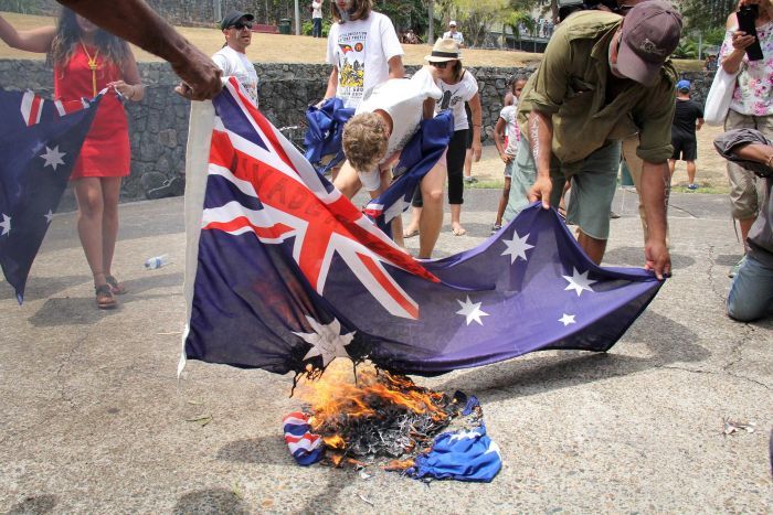 Indigenous Protestors burning the Australian Flag in Brisbane's Roma Street yesterday afternoon.