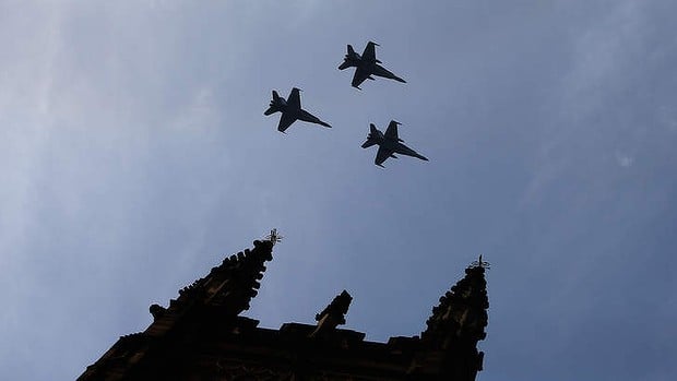RAAF FA-18 Hornets fly over St Andrew's Cathedral during the memorial service of former Australian Prime Minister Gough Whitlam at Sydney Town Hall