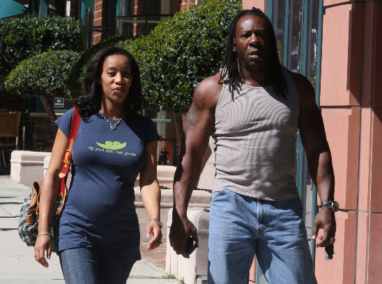 Booker T and his wife, Sharnelle, leaving the police station on Wednesday 