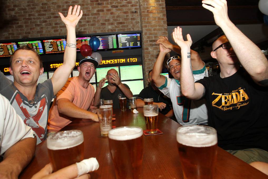 Australian men in the Betoota Hotel claiming to enjoy American Football