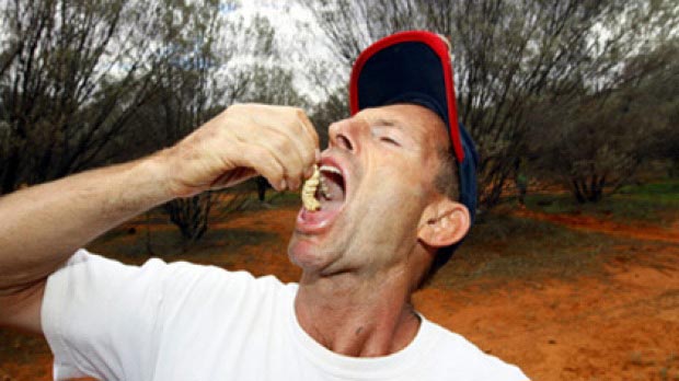 Tony rips into some Witchetty Grubs while visiting traditional lands before he became leader.