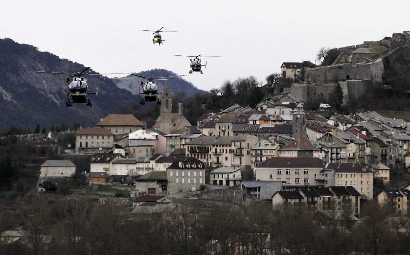 Helicopters of the French gendarmerie and emergency services fly over Seyne-les-Alpes as