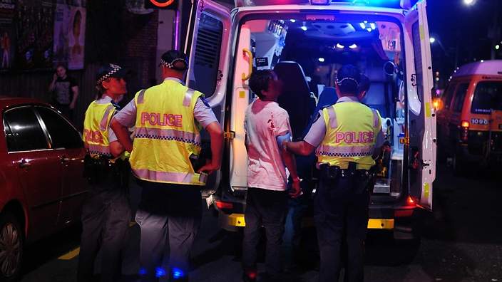 An ambulance arrives at The Waratah Hotel last night, after Ken Cranney was assaulted by hotel regular, Ted.