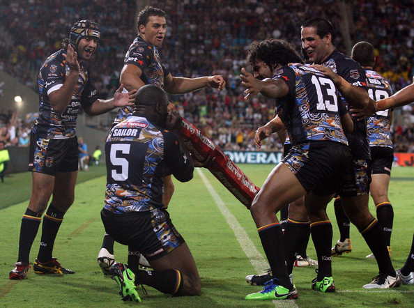 Wendell celebrates his last ever NRL try by playing an imaginary didgeridoo, surrounded by the best players in the NRL