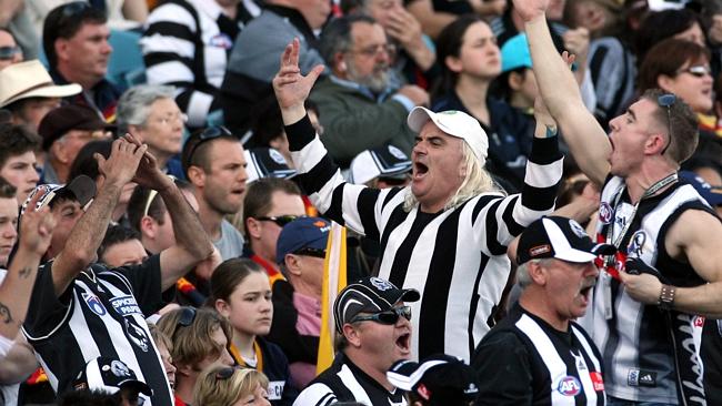 Lenny Lowy riles up the low-breed crowd of Collingwood supporters