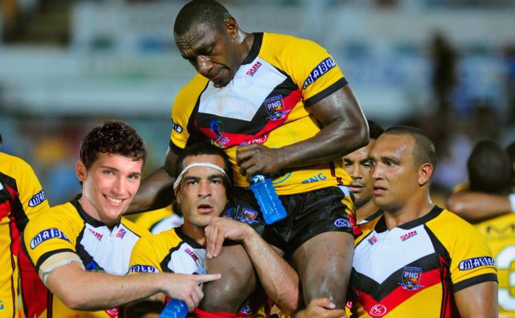 Shiva (far-left) celebrates with his team-mates, the PNG Kumuls