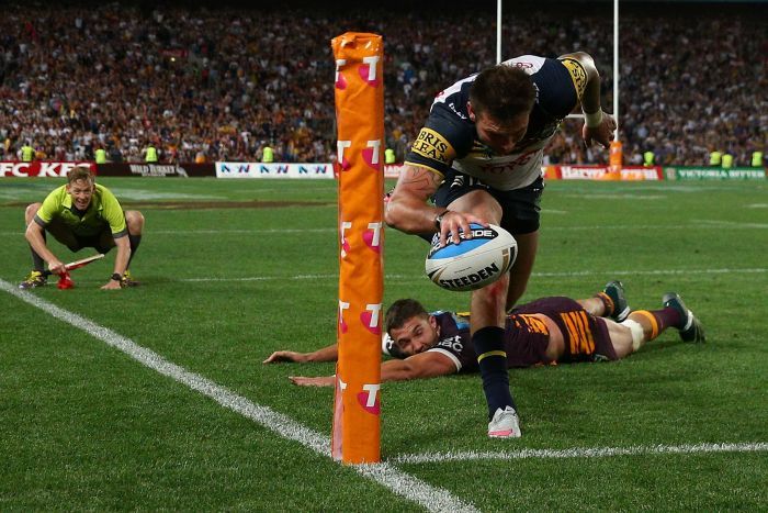 PHOTO: Miracle try ... Kyle Feldt scores in the corner in the dying seconds of regulation time. (Getty Images: Cameron Spencer)